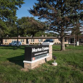 Entrance to Morton Estates Apartments with a prominent sign.