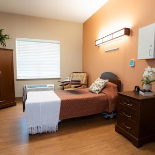 A well-furnished hospital room designed for patient comfort.