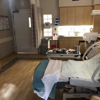 A clean and well-equipped hospital patient room.