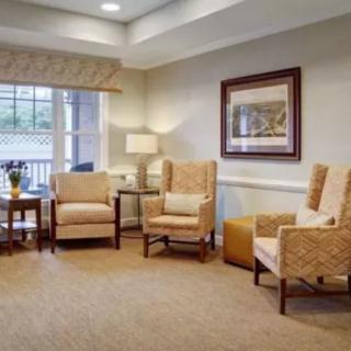 A cozy living room with comfortable chairs and warm lighting.