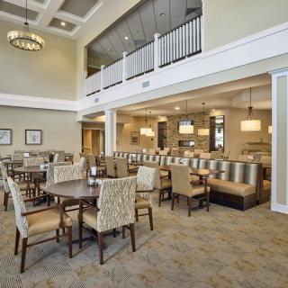 An elegant dining area with comfortable seating and modern lighting.