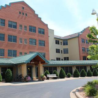 A healthcare facility with a welcoming entrance and well-maintained landscaping.