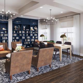 A modern living room with stylish furniture and a cozy reading nook.