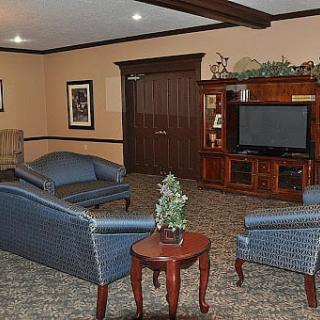 A cozy living room with comfortable seating and a television.