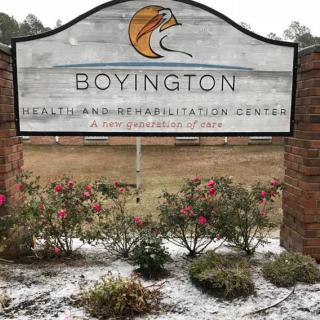 Sign for Boyington Health and Rehabilitation Center surrounded by a snowy landscape.