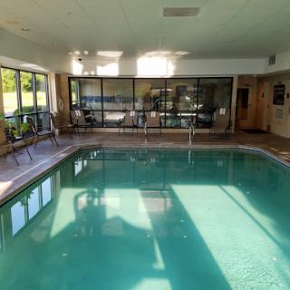 A serene indoor swimming pool area, perfect for relaxation and leisure.
