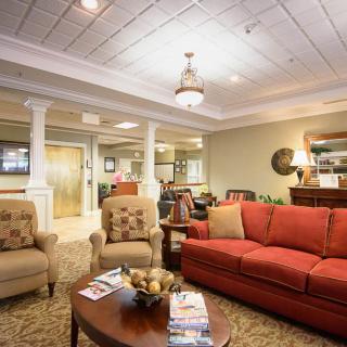 A cozy living room with comfortable seating and elegant decor.