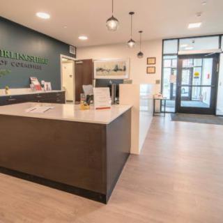 A modern reception area with a sleek desk and a welcoming atmosphere.