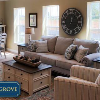 A cozy and elegantly decorated living room with comfortable seating and stylish accents.