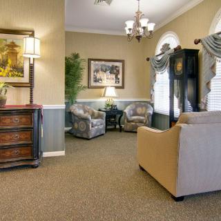 A cozy living room with elegant furnishings and soft lighting.