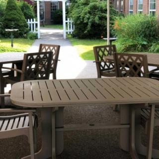Outdoor patio area with tables and chairs.