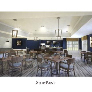 A spacious dining area with modern decor and ambient lighting.