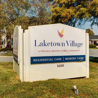 Sign for Laketown Village, a residential and memory care facility.