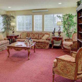 A cozy living room with classic furniture and warm lighting.