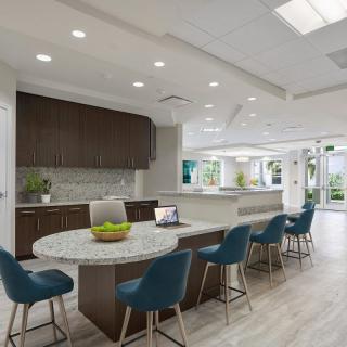 Modern kitchen with a spacious dining area and contemporary design.
