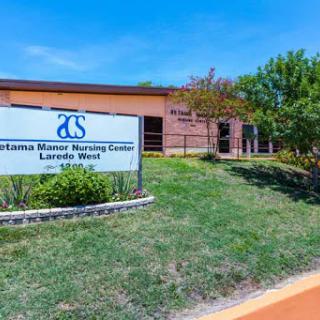 Exterior view of a nursing center with clear signage and well-maintained landscaping.