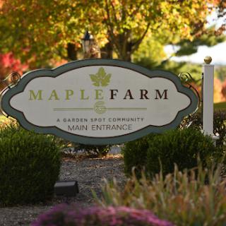 Welcome to Maple Farm, a serene escape surrounded by autumn foliage.