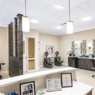 A modern office reception area with stylish furniture and decor.