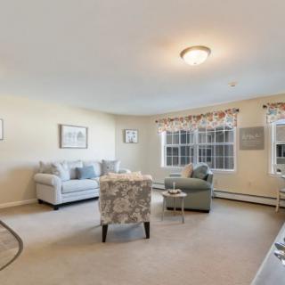 A cozy living room with comfortable seating and natural light.