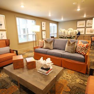 A cozy living room with stylish furniture and decorative elements.