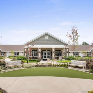 A welcoming community center with landscaped gardens and a spacious entrance.