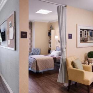 Comfortable and elegantly decorated bedroom, featuring a cozy bed and seating area with soft lighting.