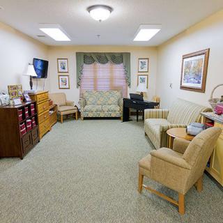 A cozy living room with comfortable seating and decor.