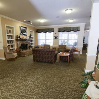 A cozy living room with comfortable seating and warm lighting.