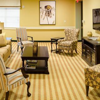 A cozy living room with comfortable furniture and a warm color scheme.