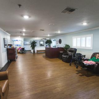 A spacious office lobby with a reception desk and comfortable seating.