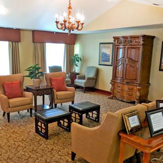 A traditional living room with comfortable seating and elegant decor.