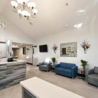 A modern and stylish reception area with comfortable seating and elegant lighting.