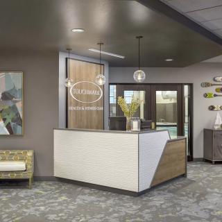 A modern office reception area with stylish furniture and contemporary lighting.