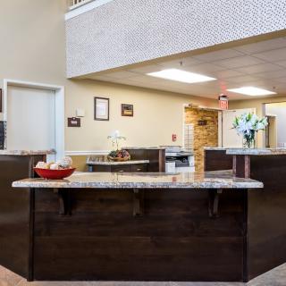 A welcoming hotel reception desk with modern interior design.