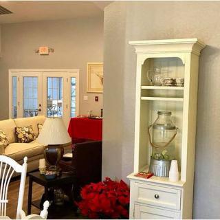 A cozy living room with elegant furnishings and bright decor.