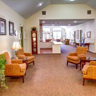 A cozy lounge area with comfortable seating and warm decor.