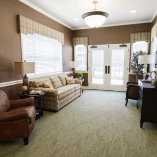A cozy living room with elegant furniture and soft lighting.