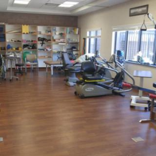 A rehabilitation center with exercise equipment and therapy areas.