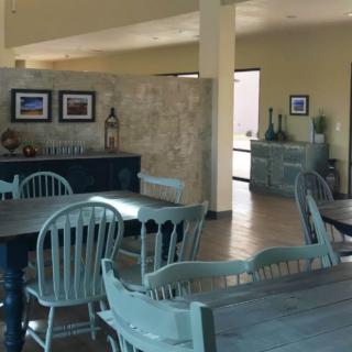 A cozy dining room with rustic furniture and decorative elements.