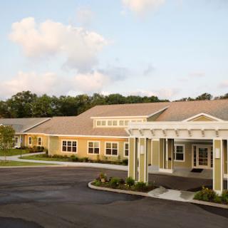 A well-designed residential facility with a welcoming entrance and landscaped surroundings.