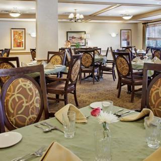 A beautifully set dining room with elegantly arranged tables and chairs.