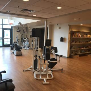 A well-equipped fitness area featuring various exercise machines in a modern space.