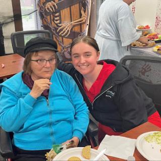 Enjoying a meal together and sharing smiles.