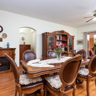A classic dining room with elegant wooden furniture and decorative accents.