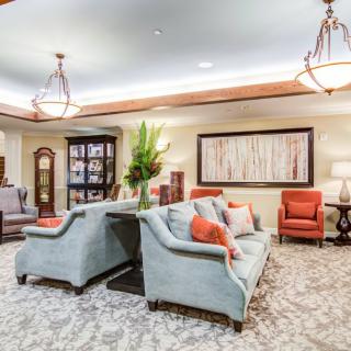 A modern living room with plush seating and elegant decor.
