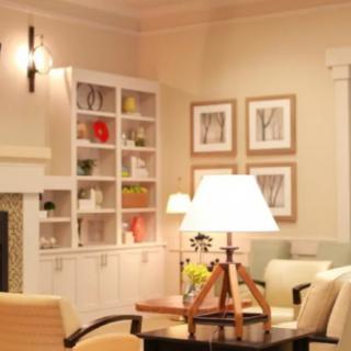 A cozy living room with elegant furnishings and warm lighting.