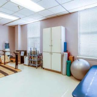 A well-equipped therapy room designed for rehabilitation and fitness activities.