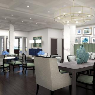 A modern living and dining area with elegant decor and contemporary furnishings.