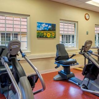 A fitness room featuring stationary bikes and cardio equipment.