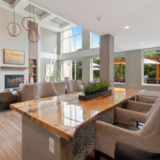 A spacious and modern living area with elegant furnishings and ample natural light.